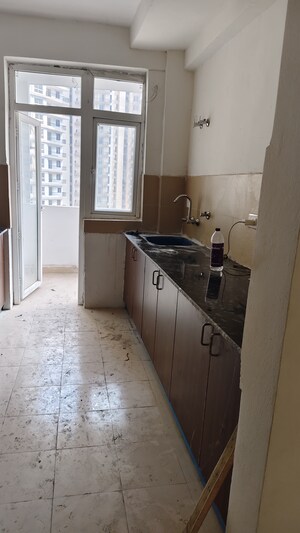 Kitchen in 3 BHK Apartment at Amrapali Heartbeat City, Sector 107 – for Sale