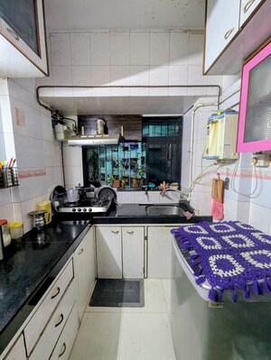 Kitchen in 1 BHK Apartment at Tilak Bhavana CHS, Tilak Nagar – for Rent