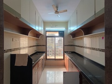 Kitchen in 3 BHK Apartment at Shree Balaji Satyam Towers, Kopar Khairane – for Rent
