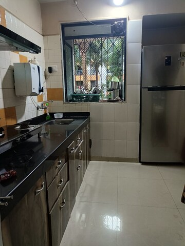 Kitchen in 1 BHK Apartment at Cosmos Park, Ghodbunder Road – for Sale