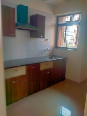 Kitchen in 1 BHK Apartment at Raunak Unnathi Woods Phase 7 A And B, Ghodbunder Road – for Rent