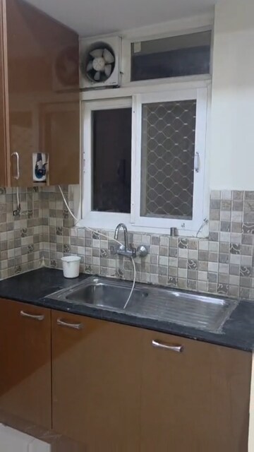 Kitchen in 3 BHK Apartment at Krishna Apra Royal Court, Sector 16 Greater Noida – for Rent