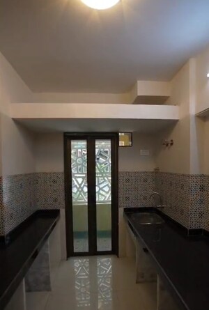 Kitchen in 2 BHK Apartment at Rassaz Greens, Mira Road – for Sale