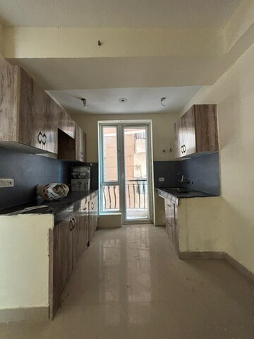 Kitchen in 2 BHK Apartment at Sikka Karmic Greens, Sector 78 – for Rent