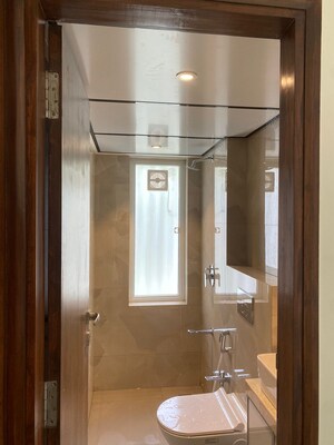 Bathroom in 2 BHK Apartment at Elegant Navratnamala CHS, Santacruz East – for Rent