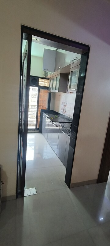 Kitchen in 2 BHK Apartment at Tharwani Rosewood Heights, Kharghar Sector 10 – for Rent