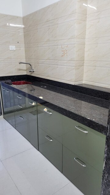 Kitchen in 1 BHK Apartment at Raunak Delight, Owale – for Rent