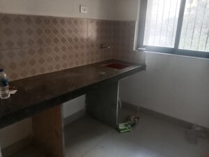 Kitchen in 1 BHK Apartment at Dosti West County, Balkum Pada – for Rent