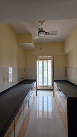 Kitchen in 2 BHK Apartment at Hubtown Greenwoods, Vartak Nagar – for Sale