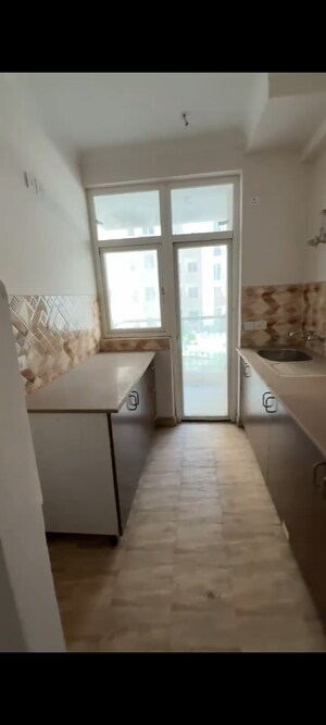 Kitchen in 2 BHK Apartment at Amrapali Leisure Park, Amrapali Leisure Valley – for Sale