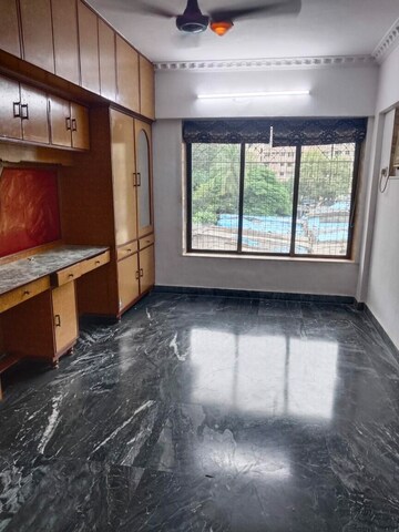 Bedroom in 2 BHK Apartment at Parijat CHS Azad Nagar, Andheri West – for Rent