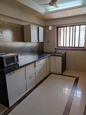 Kitchen in 3 BHK Apartment at Whispering Heights, Malad West – for Sale