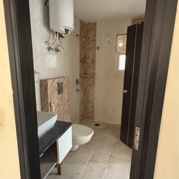 Bathroom in 3 BHK Apartment at Oxirich Avenue, Ahinsa Khand 2 – for Rent