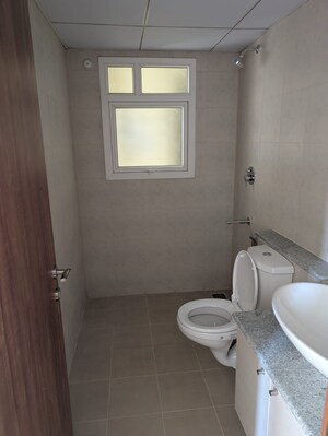 Bathroom in 2.5 BHK Apartment at Bhartiya City Nikoo Homes 4, Thanisandra Main Road – for Sale