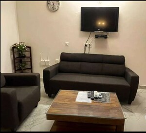 Living Room in 1.5 BHK Apartment at Vibhuti Khand – for Rent