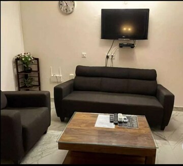 Living Room in 1.5 BHK Apartment at Vibhuti Khand – for Rent