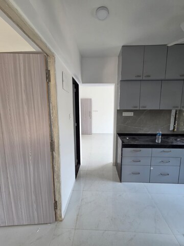Kitchen in 2 BHK Apartment at Atharva Om Gautam Residency, Malad East – for Rent