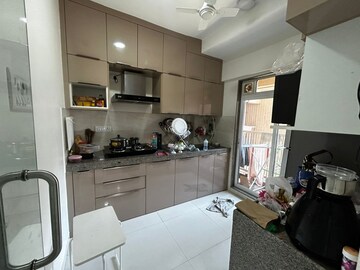 Kitchen in 1 BHK Apartment at KM Horizon Flora, Ghodbunder Road – for Sale