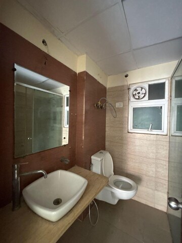 Bathroom in 3 BHK Apartment at Mahagun Moderne, Sector 78 – for Rent