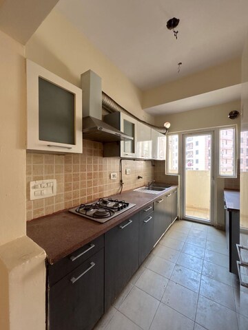 Kitchen in 3 BHK Apartment at Mahagun Moderne, Sector 78 – for Rent