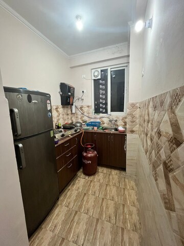 Kitchen in 2.5 BHK Apartment at Aims Golf City, Sector 75 – for Rent