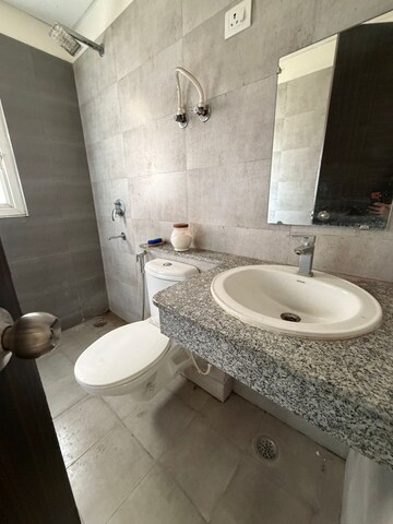 Bathroom in 2 BHK Apartment at Aims Golf Avenue I, Sector 75 – for Rent