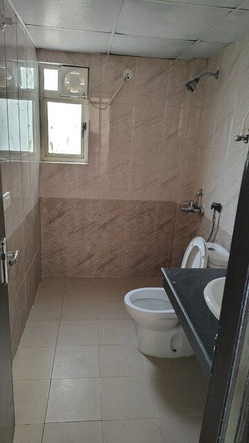 Bathroom in 2 BHK Apartment at Aims Golf Avenue I, Sector 75 – for Rent