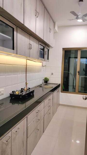 Kitchen in 3 BHK Apartment at Oberoi Realty Woods, Goregaon East – for Sale