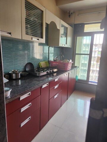 Kitchen in 2 BHK Apartment at Tharwani Rosewood Heights, Kharghar Sector 10 – for Rent