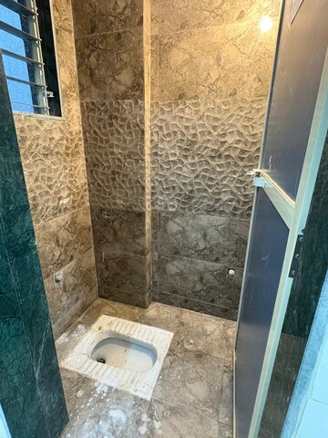 Bathroom in 2 BHK Apartment at Arsiwala Essar Apex, Virar West – for Sale