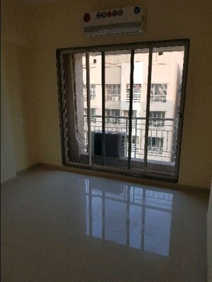 Room in 2 BHK Apartment at K Raheja Palm Court, Malad West – for Rent