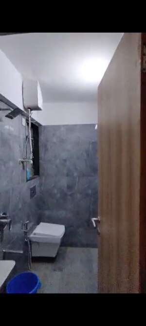 Bathroom in 2 BHK Apartment at Pratham ARC Aura, Andheri West – for Rent