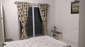 Bedroom in 2 BHK Apartment at Rustomjee Urbania Azziano, Thane West – for Rent