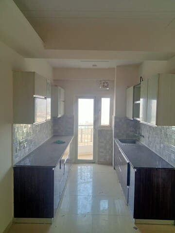 Kitchen in 3 BHK Apartment at ATS Rhapsody, Sector 1 Greater Noida – for Rent
