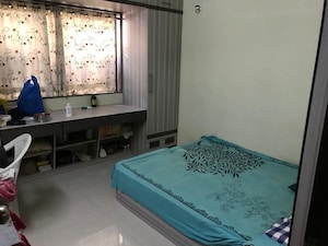 Bedroom in 2 BHK Apartment at Rahu Nisarg Society, Warje – for Rent