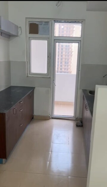 Kitchen in 3 BHK Apartment at Amrapali Heartbeat City, Sector 107 – for Rent