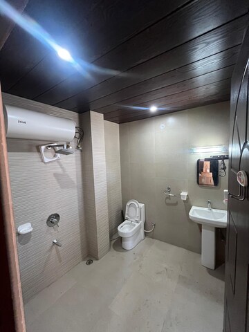 Bathroom in 3 BHK Builder Floor at Sahastradhara Road – for Sale