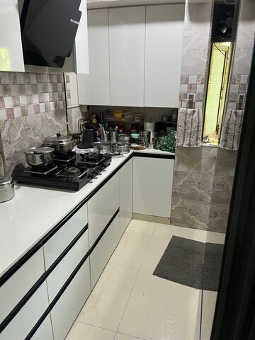 Kitchen in 3 BHK Apartment at Dream Shubhamkaroti CHS, Bhaskar Colony – for Sale
