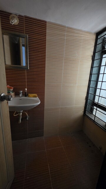 Bathroom in 1 BHK Apartment at Eden Woods complex, Manpada – for Sale