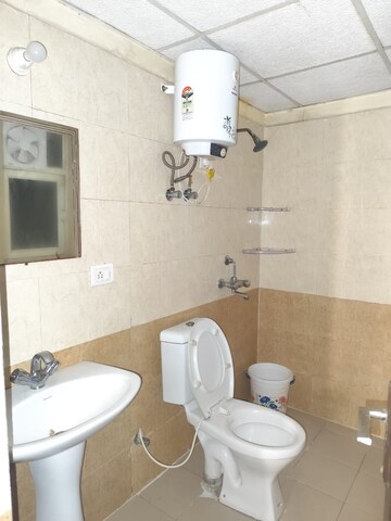 Bathroom in 2 BHK Apartment at Aims Golf City, Sector 75 – for Rent