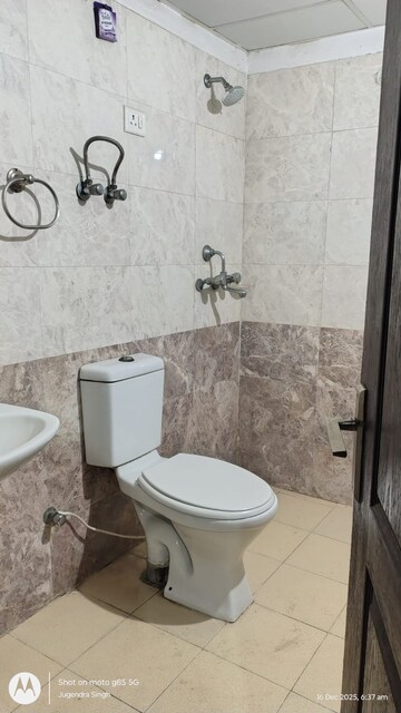 Bathroom in 2 BHK Apartment at Aims Golf City, Sector 75 – for Rent