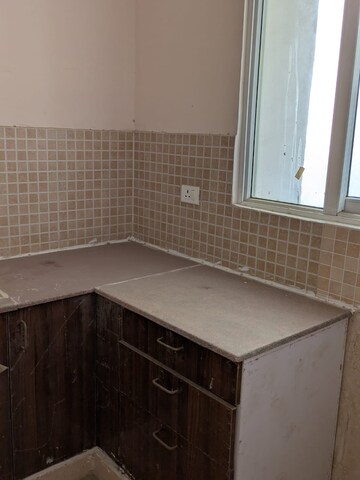 Kitchen in 2 BHK Apartment at Amrapali Golf Homes, Sector 4 Greater Noida – for Sale