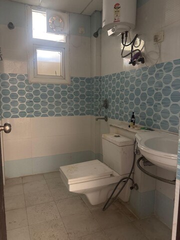 Bathroom in 3 BHK Apartment at Purvanchal Royal Park, Sector 137 – for Rent