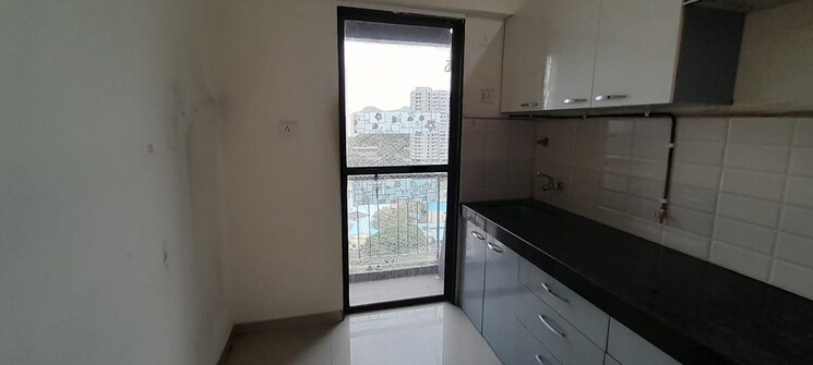 Kitchen, man-opus 1.5 Bedroom 750 Sq.Ft. Apartment In Mira Road Thane 9727150