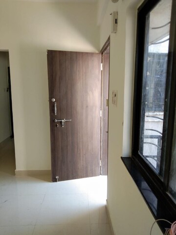 Living Room in 2 BHK Apartment at Ganeshnagar CHS, Kothrud – for Rent