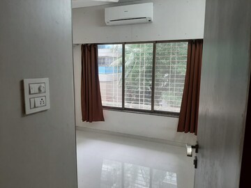 Bedroom in 1 BHK Apartment at Dheeraj Godavari Apartment, Malad West – for Sale