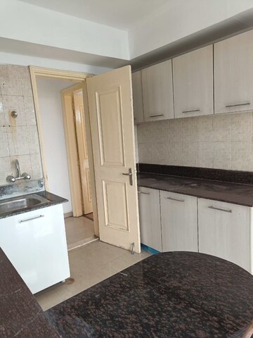 Kitchen in 3 BHK Apartment at Mahagun Mezzaria, Sector 78 – for Rent