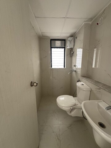 Bathroom in 1 BHK Apartment at Runwal Gardens Phase 2, Dombivli East – for Rent