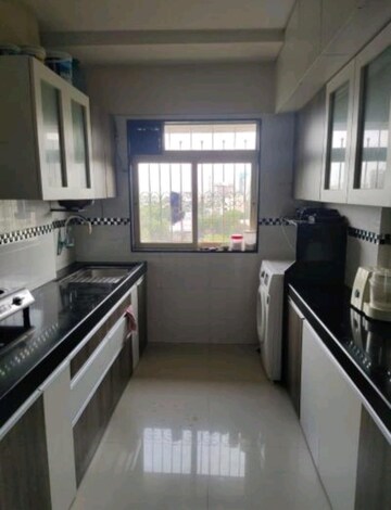 Kitchen in 2 BHK Apartment at Shiv Shakti CHS Malad West, Malad West – for Sale