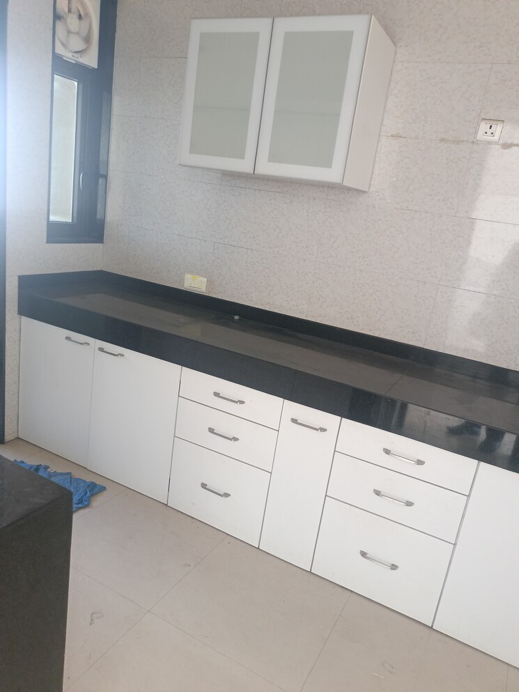 Kitchen, peninsula-celestia-spaces 3.5 Bedroom 1450 Sq.Ft. Apartment In Parel Mumbai 9731469